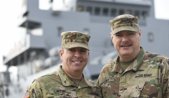 Two army officials smiling