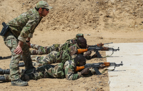 Three army snipers with guns