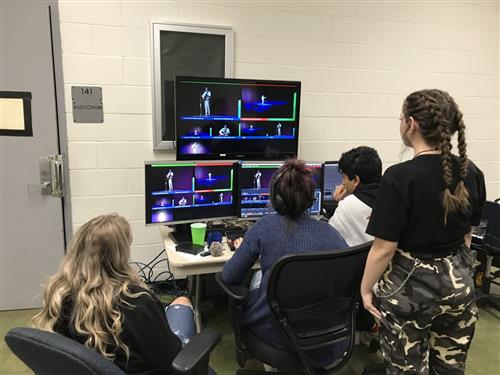 Students run a mobile broadcast control room during an event. 