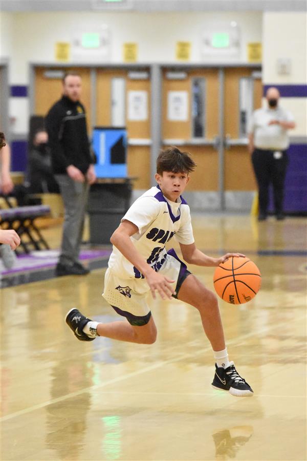 SSHS basketball player with a basketball in his left hand at SSHS  